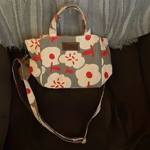 White flower and grey background purse